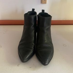Black pointy boots by Marc Fisher